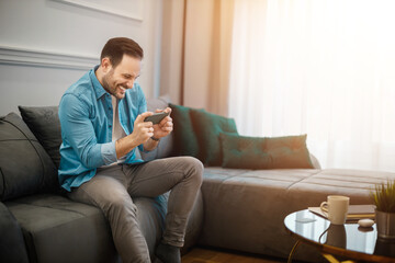 Happy Man Celebrates Winning Ticket at Home
