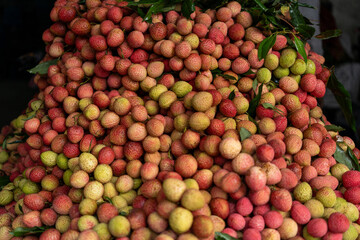 Ripe lychees, ready for sale at the market. Vibrant colors and juicy sweetness of this tropical delight, straight from the orchard to your table. Lychee, Litchi, Lichee, fruit