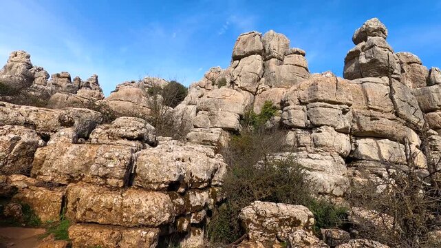 Hiking in the Torcal de Antequerra National Park, limestone rock formations and known for unusual karst landforms in Andalusia, Malaga, Spain.