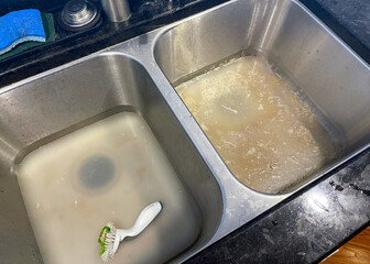 Stainless steel kitchen sink clogged and backed up