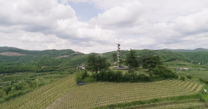 Aerial drone view pan of the Collio hills, Cormons, Nova Gorica near Gorizia. European Capital of Culture 2025. Typical local products vineyards and wines. Gonjače Tower places to visit and tradition.