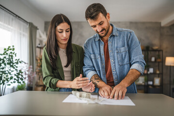 Couple learn and practice how to make a clay figurine, pottery