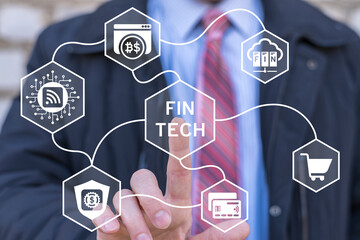 Business man working on virtual touch screen touched text: FINTECH. Fintech Financial Cryptocurrency Investment technology and digital money concept.