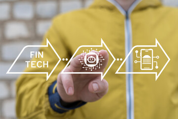 Man working on virtual touch screen sees inscription: FINTECH. Concept of fintech - financial technology. Banking stock trading. Finance internet technology.