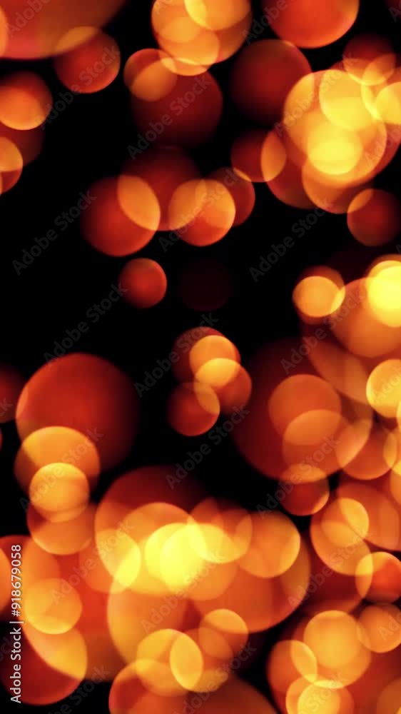 Poster abstract bokeh golden particles. seamless loop of abstract background made of bokeh circles and part