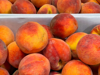 Baskets full of fresh, tree-ripened peaches