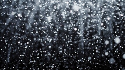 Obraz premium A black and white photo of snow falling