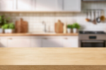 Kitchen wood table top for product display with blurred modern interior. Wooden tabletop over defocused kitchen background. kitchen furniture and desk space. product promotion in the kitchen