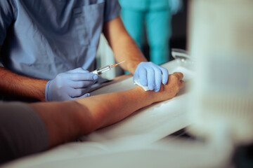 Patient After Anesthesia Injection getting ready for Hand Surgery. Orthopedics specialist ready to operate on a sedated person 
