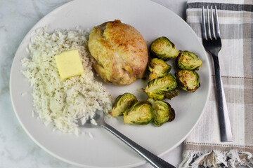 chicken thigh with brussel sprouts anf rice