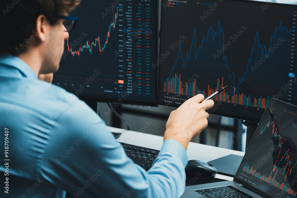 Poster working young professional business trader concentrating on market stock graph investing in real tim