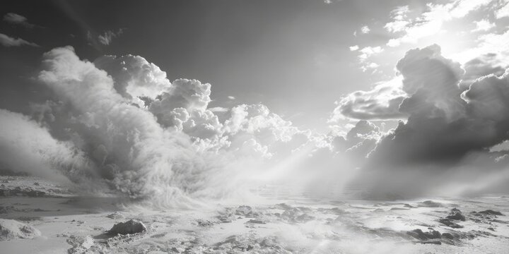 A cloudy black and white sky with fluffy clouds, suitable for use in weather or atmospheric themed designs