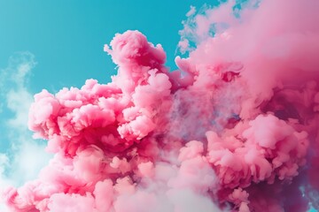 Fototapeta premium A vivid display of pink smoke billows against a clear blue sky, creating a stunning visual contrast and artistic effect.