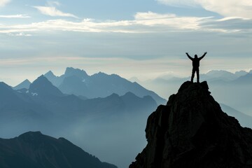 A silhouette of a man standing triumphantly on a mountain peak with arms raised, set against a serene sunrise backdrop.