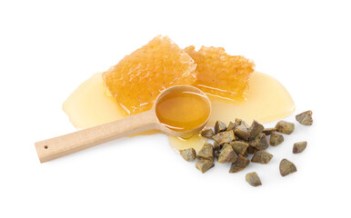 Sweet honeycombs and propolis granules isolated on white