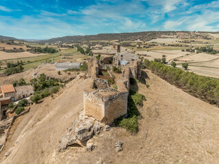 Fototapeta premium Aerial view of Huerta de la Obispalia in La Mancha Spain, hilltop medieval fortification with pentagonal bastion gun platforms at both ends