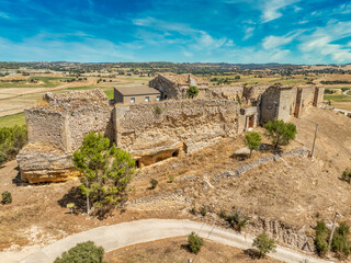 Aerial view of Huerta de la Obispalia in La Mancha Spain, hilltop medieval fortification with pentagonal bastion gun platforms at both ends