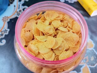 Cornflakes in a transparent container on the table, photo takenin malaysia
