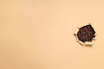 Fragrant coffee beans on a light background