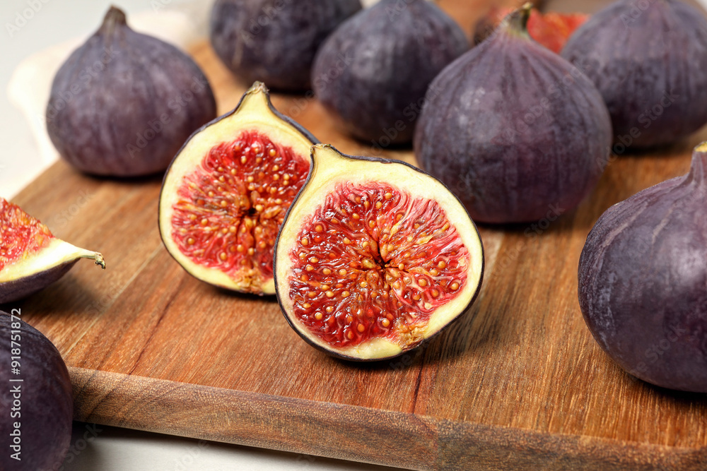 Sticker fresh ripe figs on a wooden board