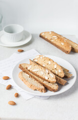 almond biscotti on a white plate, almond cantucci cookies on a white plate