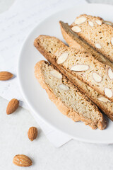 almond biscotti on a white plate, almond cantucci cookies on a white plate, biscotti cookies or...