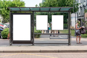 Three Blank Vertical Mockups Of Bus Stop Billboards In Front Of A City Park. Empty White...
