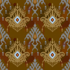 A repeating pattern with abstract, earthy-toned motifs on a brown background. The design includes intricate details with blue and orange accents, creating a warm and textured look.

