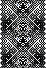 A black and white pixelated geometric pattern with intricate diamond shapes and small floral accents, creating a traditional yet modern design.
