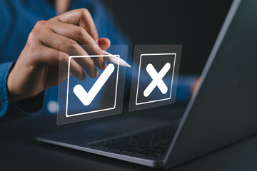 Businessman is thinking and making choices between right and wrong symbols. Decide to vote concept....