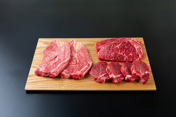 Sliced ​​beef on a black background