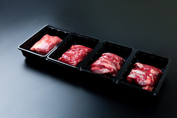 Sliced ​​beef on a black background