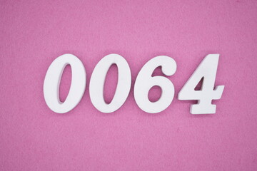 The numbers are made of white painted wood. Laying on the floor was pink paper.