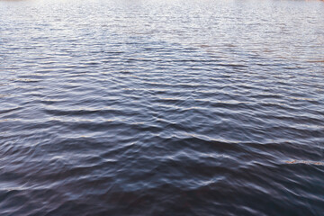 Picture of a lake with calm waves.