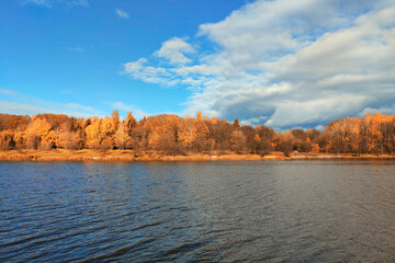 Autumn lake on dark background.