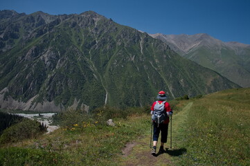 Senior woman hiking in Ala Archa National Park in Kyrgyzstan