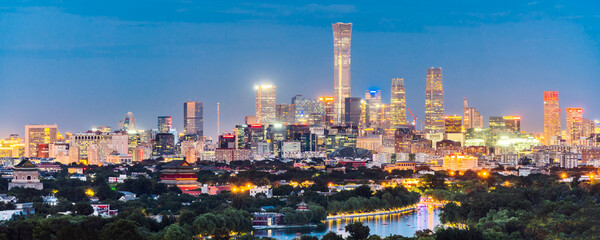 Obraz premium High angle night view of Guomao CBD and Bell and Drum Tower in Beijing, China