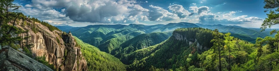 Obraz premium Mountain Vista with Majestic Clouds and Verdant Slopes
