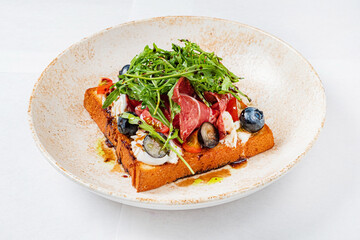 toast with cheese, ham and blueberries