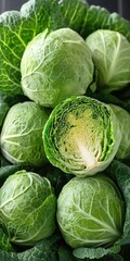 Fototapeta premium Fresh green cabbages, whole and cut