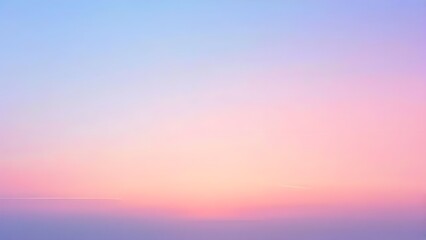 Obraz premium A smooth sky gradient background transitioning from light blue to pale pink at sunset