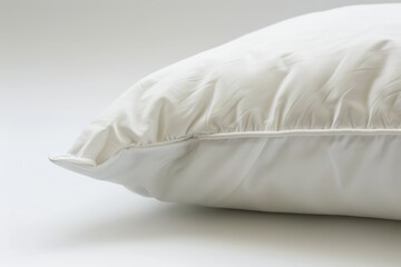 White pillow on white background in close up