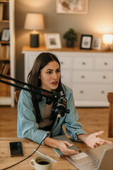 Smiling content creator recording an internet podcast for her social media channel
