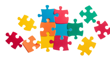 Colorful puzzle pieces scattered on a white background, perfect for representing education, problem-solving, and teamwork concepts.