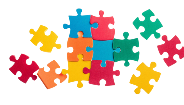 Colorful puzzle pieces scattered on a white background, perfect for representing education, problem-solving, and teamwork concepts.