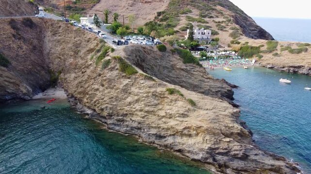 Drone flies near the beach in evita bay Bali on Crete in Greece sea is blue and clear a beautiful bay with beach
