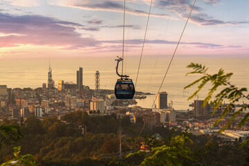 Beautiful view of the city of Batumi in Georgia, descent of the funicular to the bottom at sunset with a view of the city