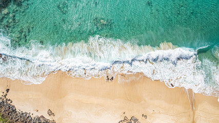 Waves Gently Crashing on Sandy Beach