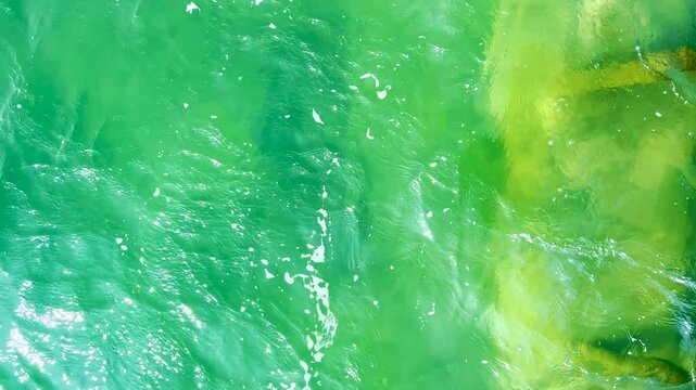 Beautiful turquoise green water background on summer sea beach
