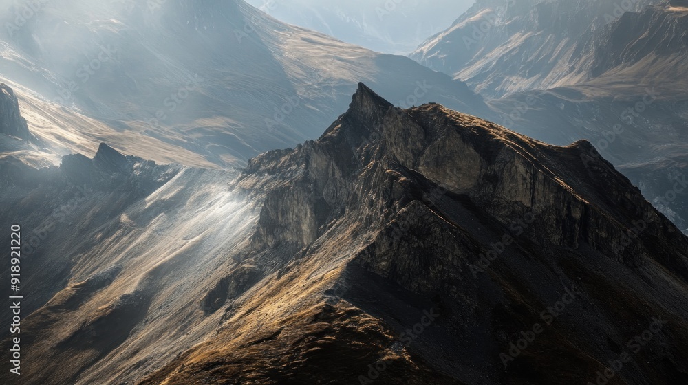 Wall mural A Rugged Mountain Peak Bathed in Sunlight